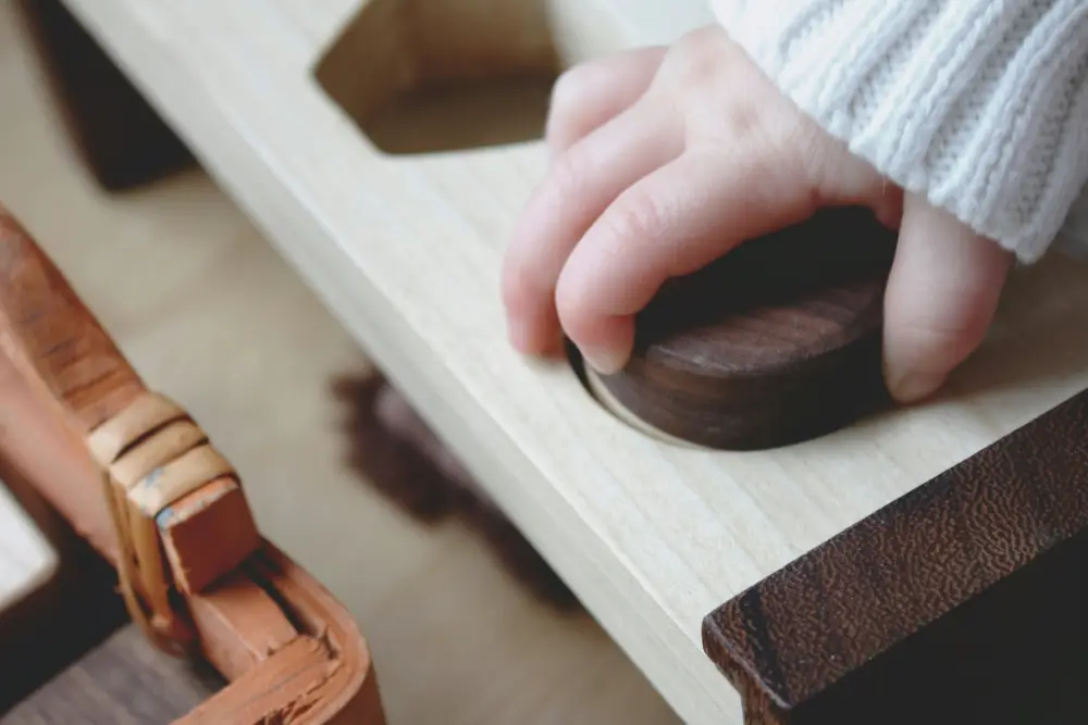 Child completing a Montessori practical life activity